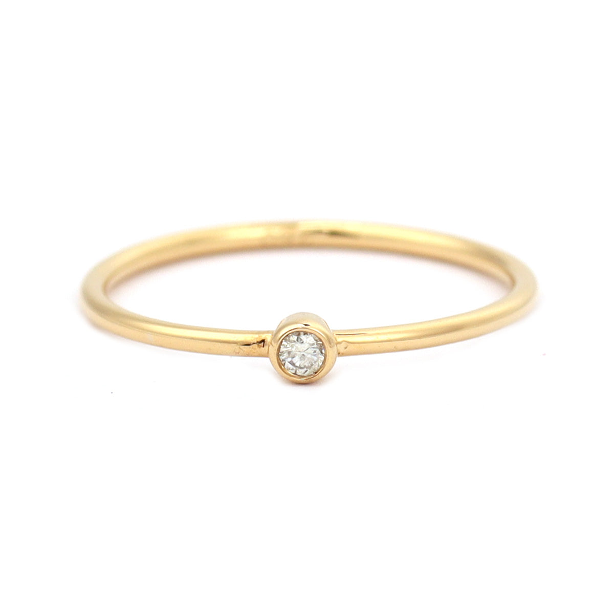 18K gold bezel-set diamond ring featuring 0.03 carat round brilliant diamond, minimalist fine jewellery by Faber Jewels